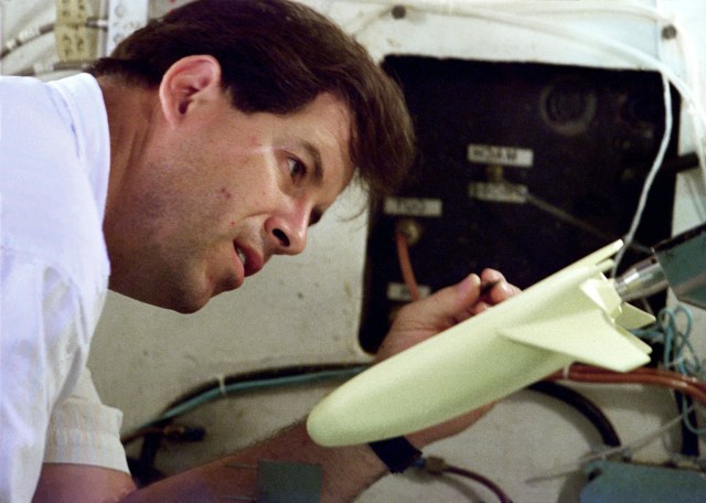 A man inspecting the X-33 model prior to testing.