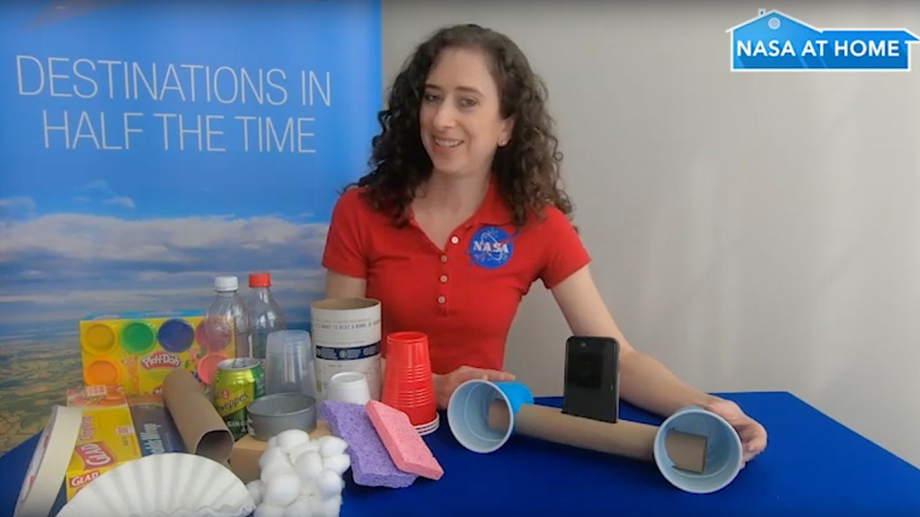 NASA employee demonstrating the supplies needed to do the Zoom Without the Boom demo activity.