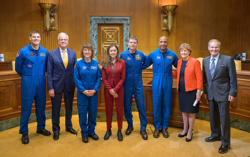Group photo with CSA astronaut Hansen, left, Sen. Moran, NASA Astronaut Koch, CSA President Campbell, NASA astronauts Wiseman, and VGlover, Sen. JShaheen, and NASA Administrator Nelson