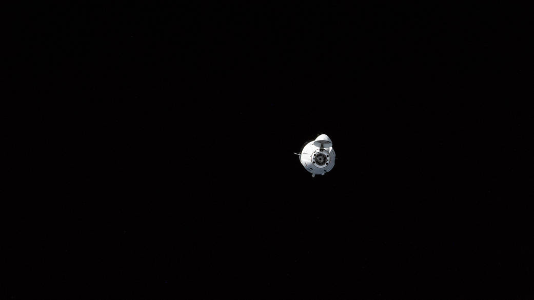 The SpaceX Dragon crew ship, with four astronauts aboard, is seen in orbit