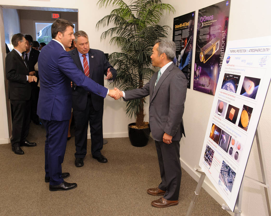 NASA Ames Center Director Pete Worden introduces Italian Prime Minister Matteo Renzi to Dr. George Raiche, Branch Chief of Thermophysics Facilities...