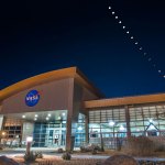 Armstrong Flight Research Center's mission support building with a composite of 16 images of the eclipsed moons overhead