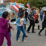 Attendees at Marshall Space Flight Center's Hispanic Heritage Month Food Truck Fiesta dance as they enjoy music at the Oct. 26 event at the Food Truck Corral.