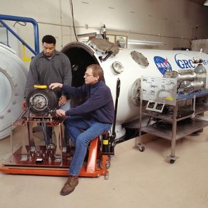 Technicians preparing hardware for installation