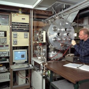 Technician adjusts wiring on Vacuum Facility 52