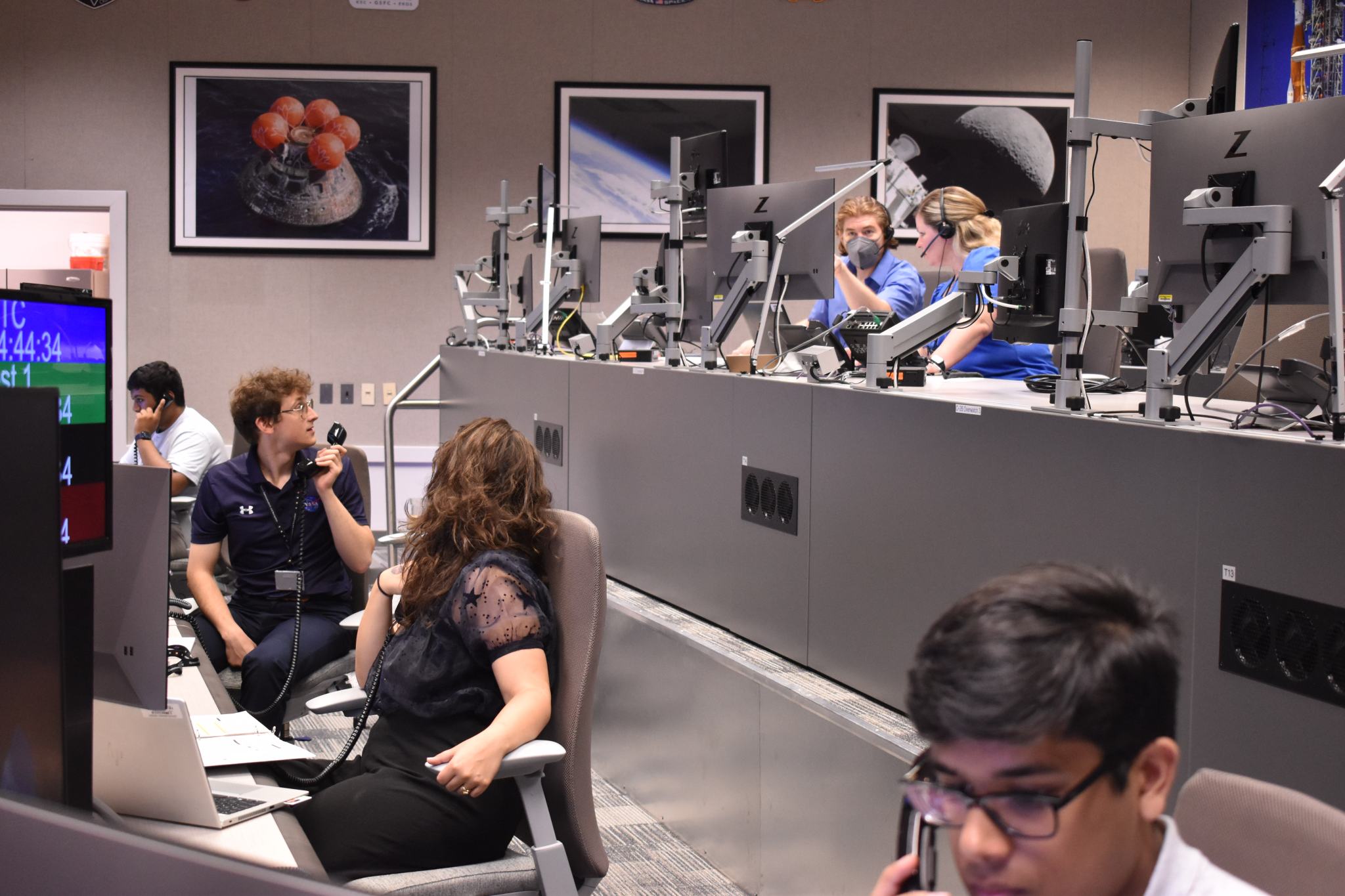 SIP students participating in a network operations simulation activity, “Down to the Wire" in the Near Space Operations Control Center at NASA Goddard. Students took on the role of flight controllers and practiced communication, working through problems in a stressful situation, and careful decision-making.