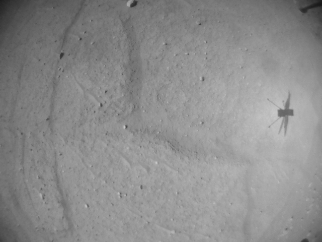 NASA’s Ingenuity Mars Helicopter is seen in shadow in an image captured by its navigation camera during the rotorcraft’s 52nd flight on April 26.