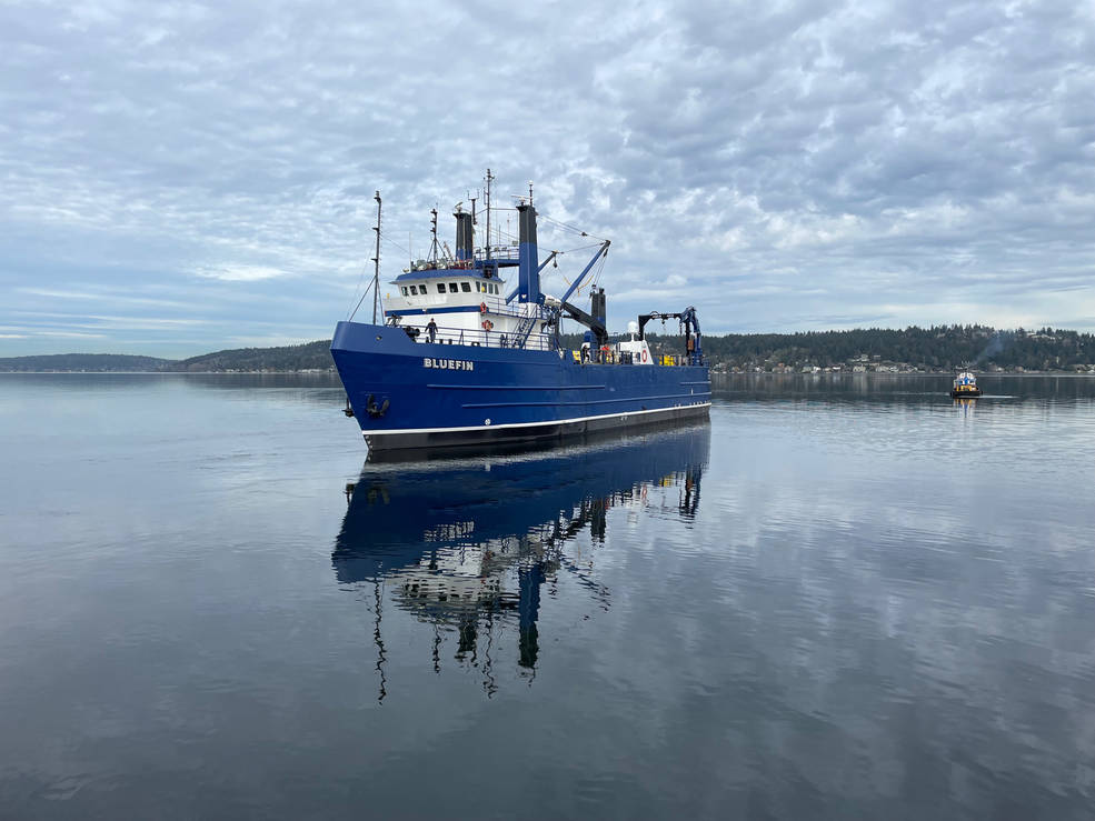 A ship carrying some of the ocean moorings for the SWOT calibration and validation efforts heads out to sea from the Seattle area in February.