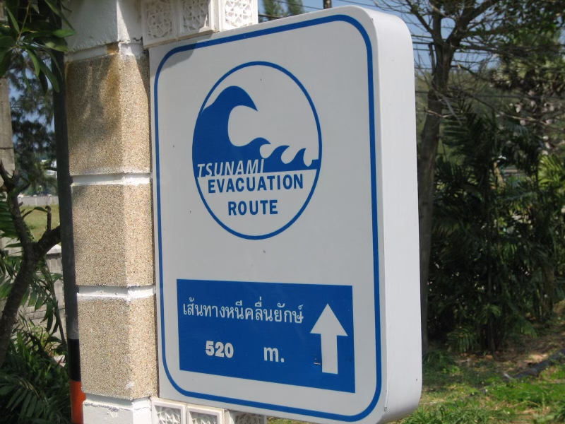 An evacuation sign points to safer ground in Phuket, Thailand