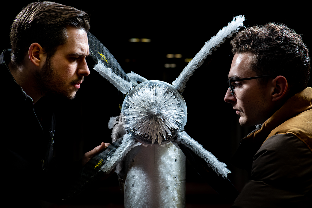 Curtis Flack (left) and Paul von Hardenberg inspecting the ice that formed on the proprotor model.