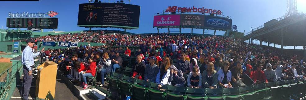 Photo of Dave Draper speaking to 4,000 middle school students at Fenway Park