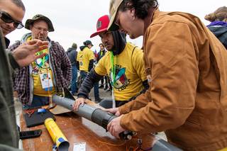 The team from University of North Carolina, Pembroke â€“ this years Outreach Award Winners â€“ make final preparations to their rocket on launch day.