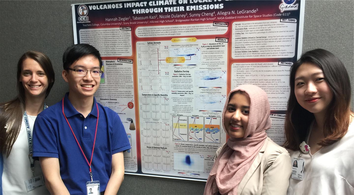 A CCRI teacher and three students present a poster paper about volcanoes' impact on climate.