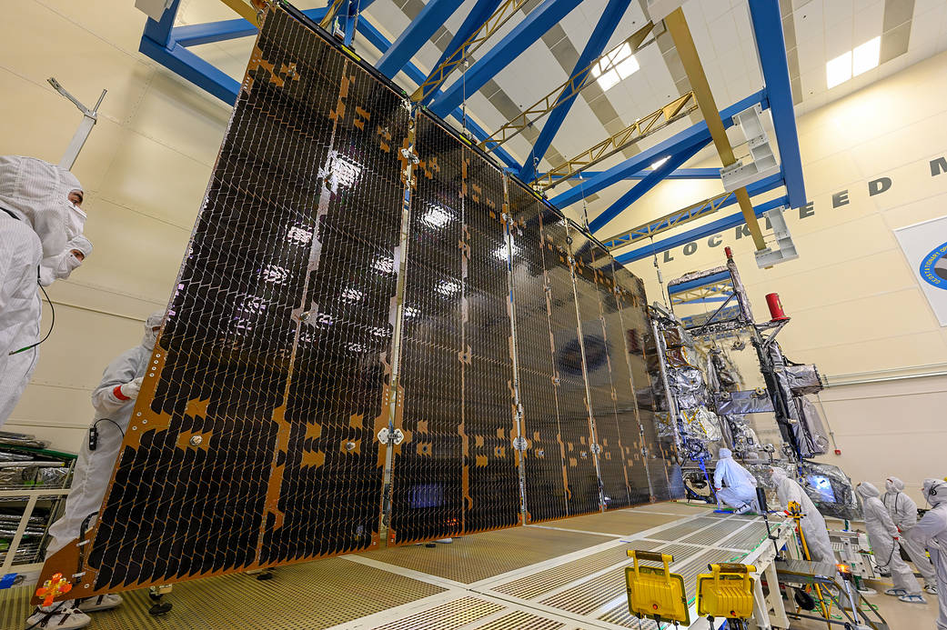 The GOES-U solar arrays fully extended out inside a cleanroom.