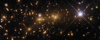 The exceptional galaxy cluster eMACS J1353.7+4329, which lies about eight billion light-years from Earth in the constellation Canes Venatici.