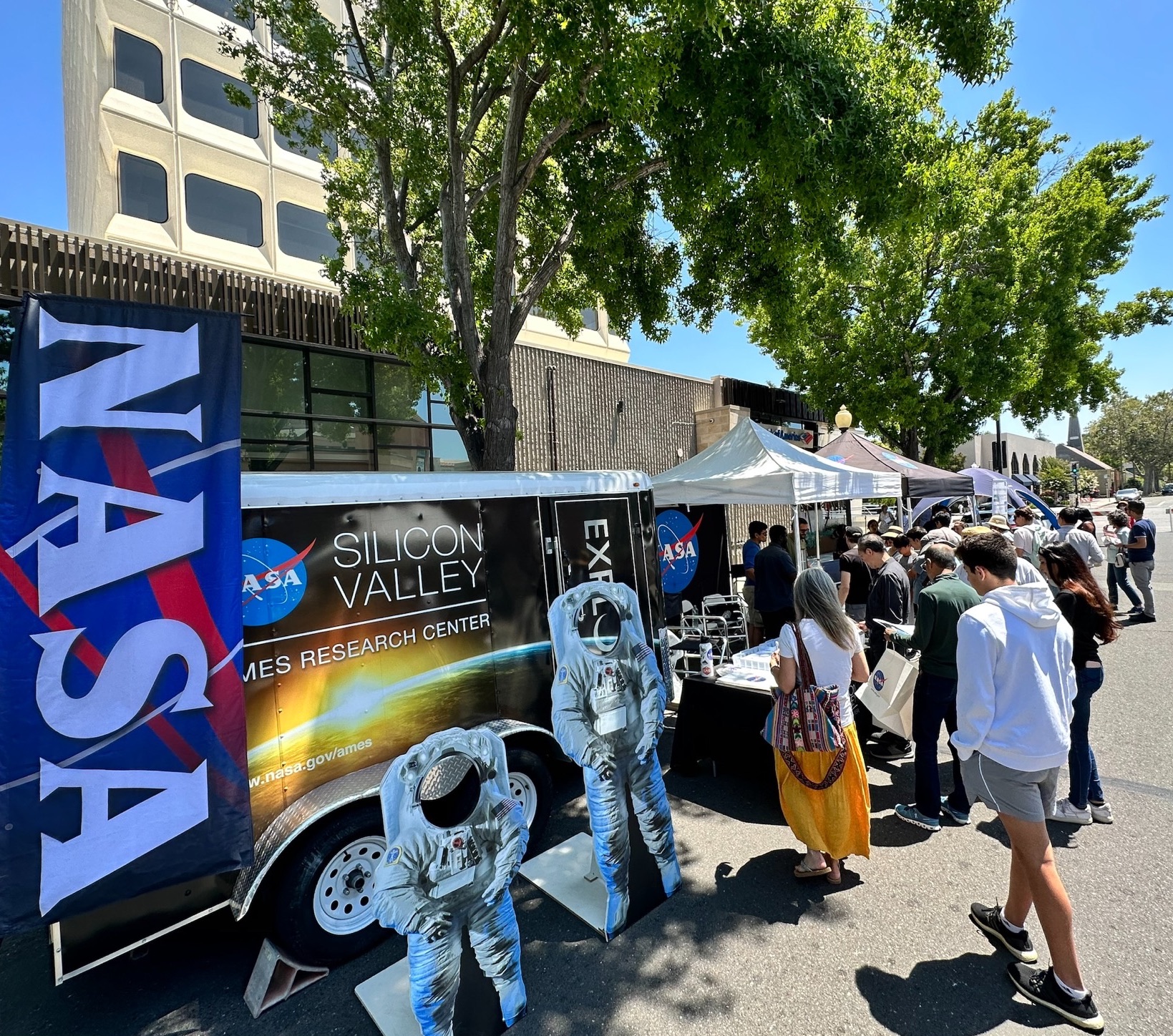 Public visiting the Ames booth at Tech Showcase