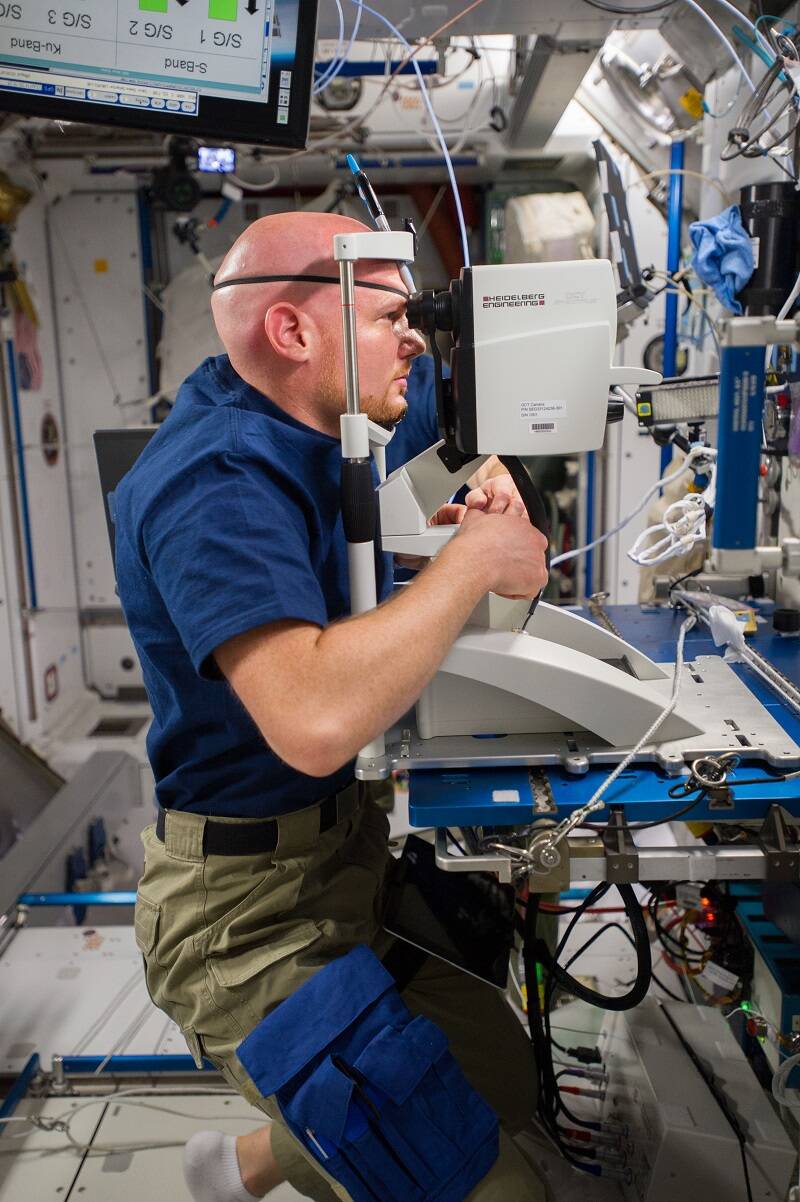 ESA (European Space Agency) astronaut Alexander Gerst performs an eye exam for the Ocular Health investigation.