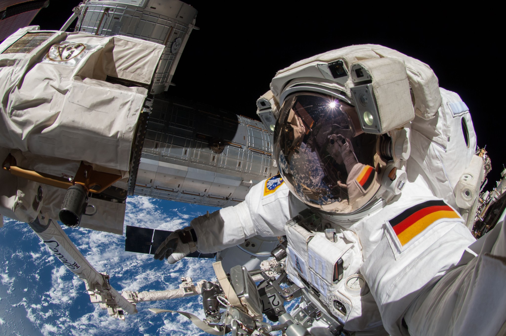 Astronaut Alexander Gerst conducts a spacewalk to relocate a failed cooling pump.