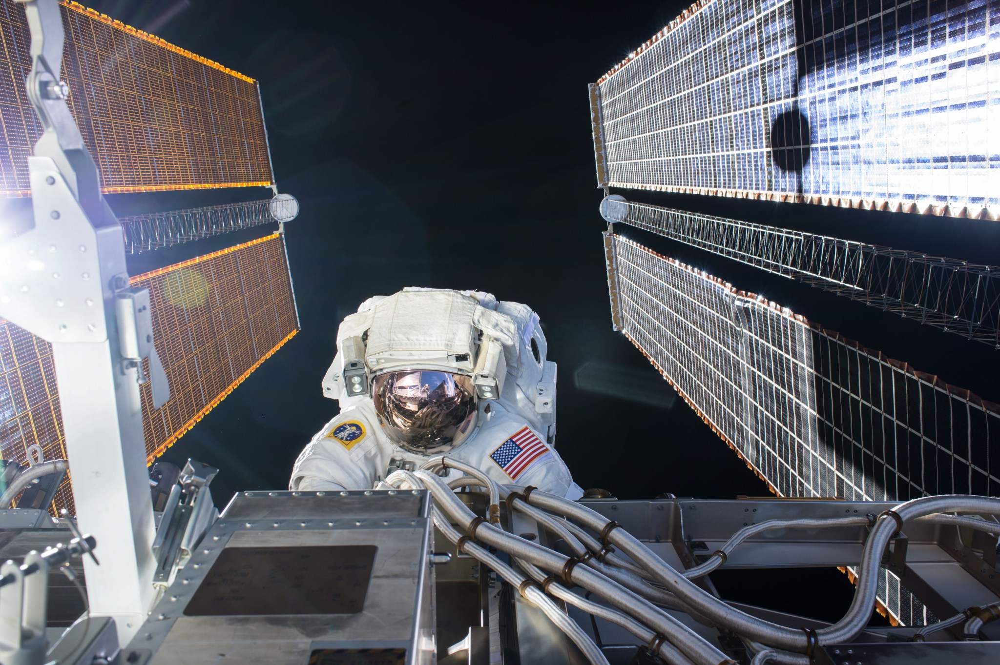 Astronaut Kate Rubins conducts a spacewalk to retract a thermal radiator, install high definition cameras, and tighten bolts on the International Space Station.