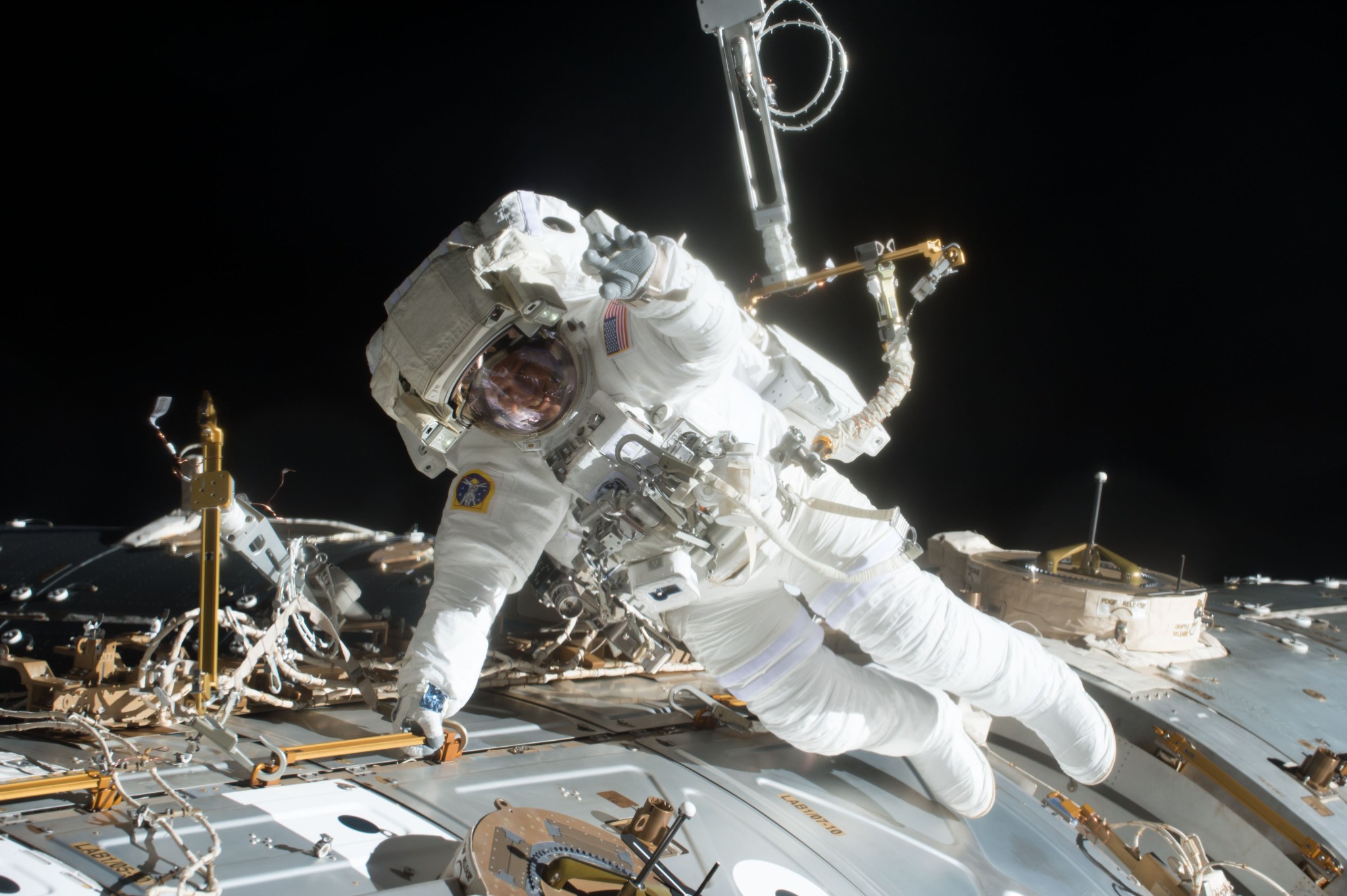 Astronaut Jack Fischer works outside the U.S. Destiny laboratory module to attach wireless antennas on the International Space Station.
