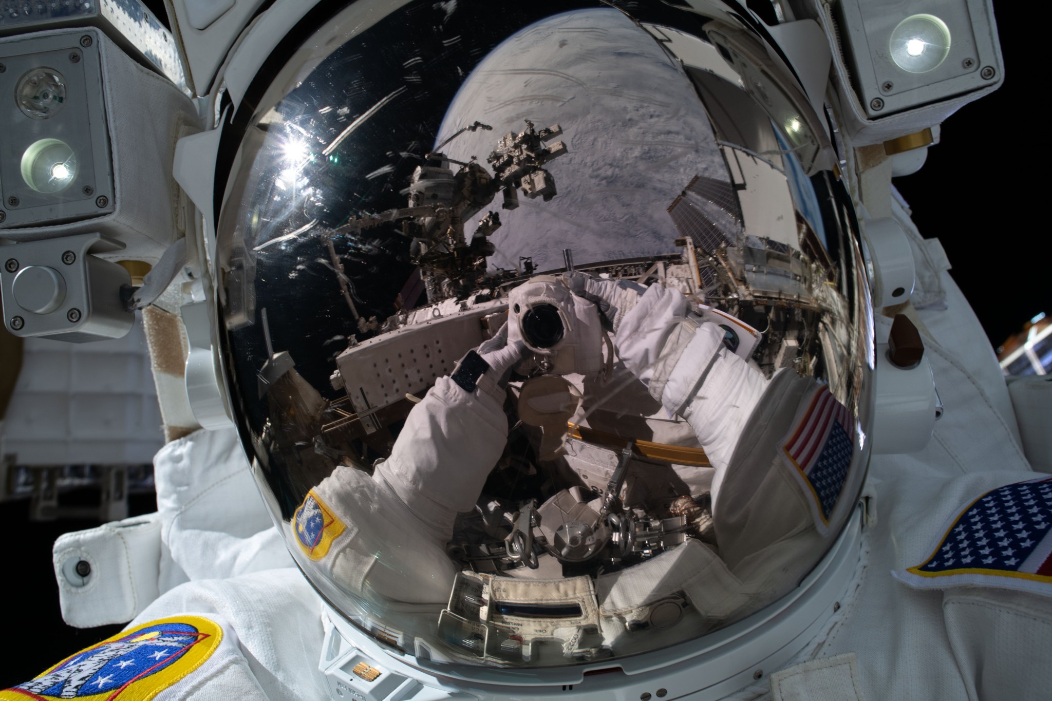 NASA spacewalker Kayla Barron points the camera toward herself and takes an out-of-this-world "space-selfie."
