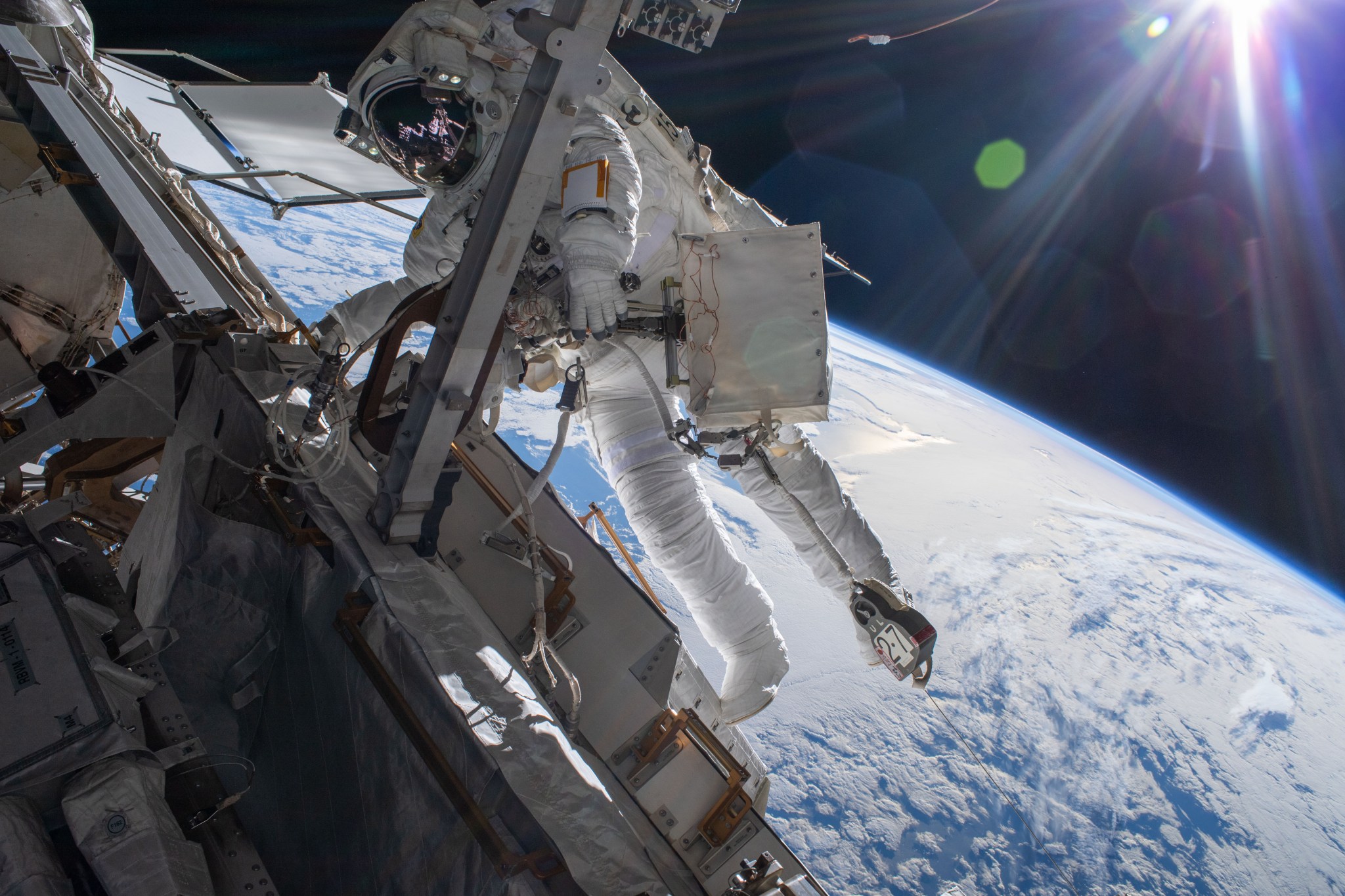 Astronaut Matthias Maurer of ESA (European Space Agency) is pictured on the International Space Station's truss structure during a spacewalk to install thermal gear and electronics components on the orbiting lab,