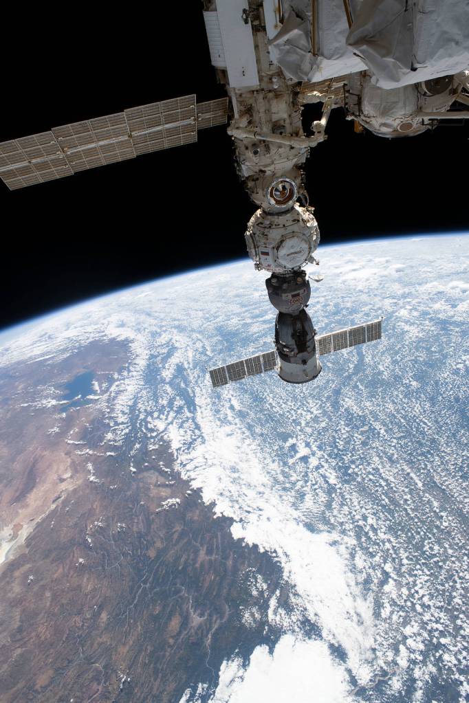 The space station orbits above the Andes mountain range in Bolivia