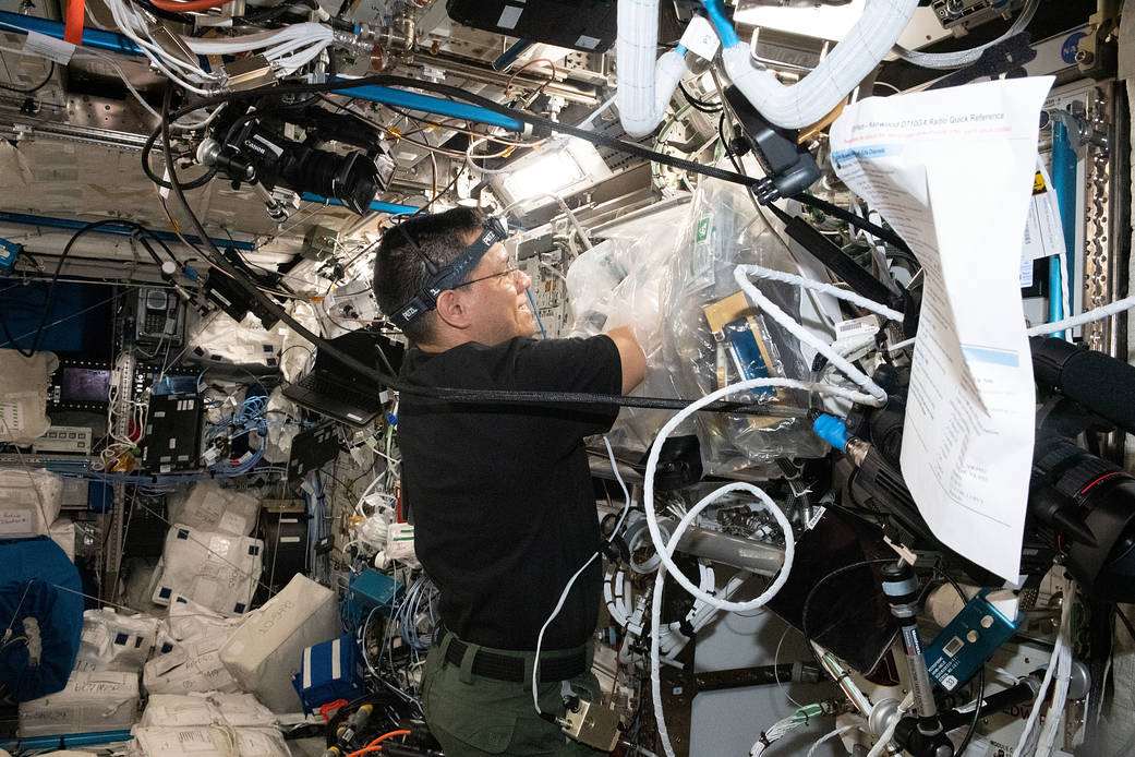Astronaut Frank Rubio works on a 3D bioprinter