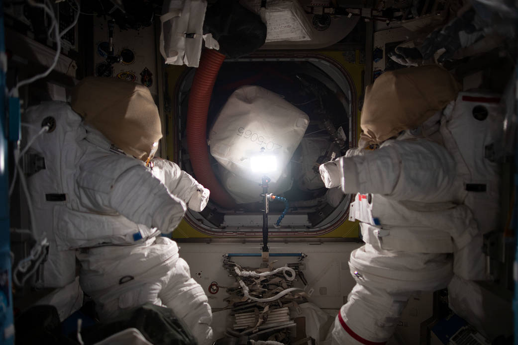 Spacesuits pictured inside the Quest airlock