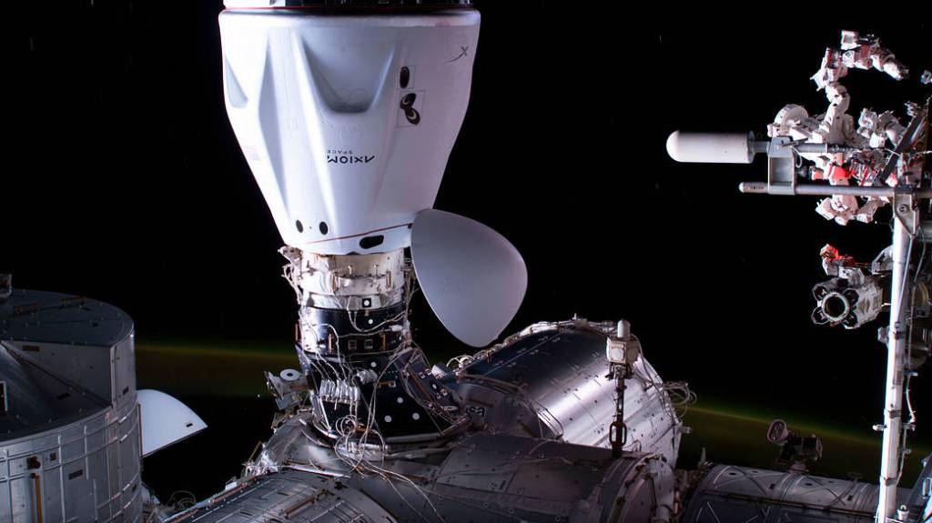 The SpaceX Dragon Freedom spacecraft is pictured docked to the station
