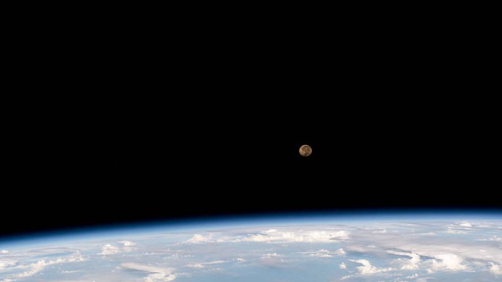 The waning gibbous Moon above Earth’s horizon