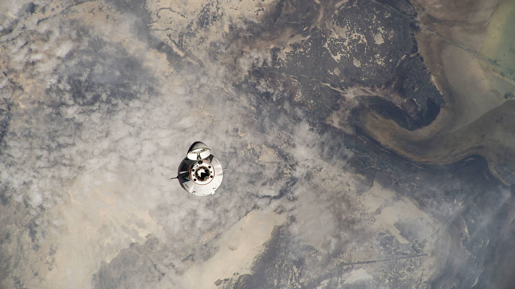 The SpaceX Dragon cargo vehicle approaches the space station