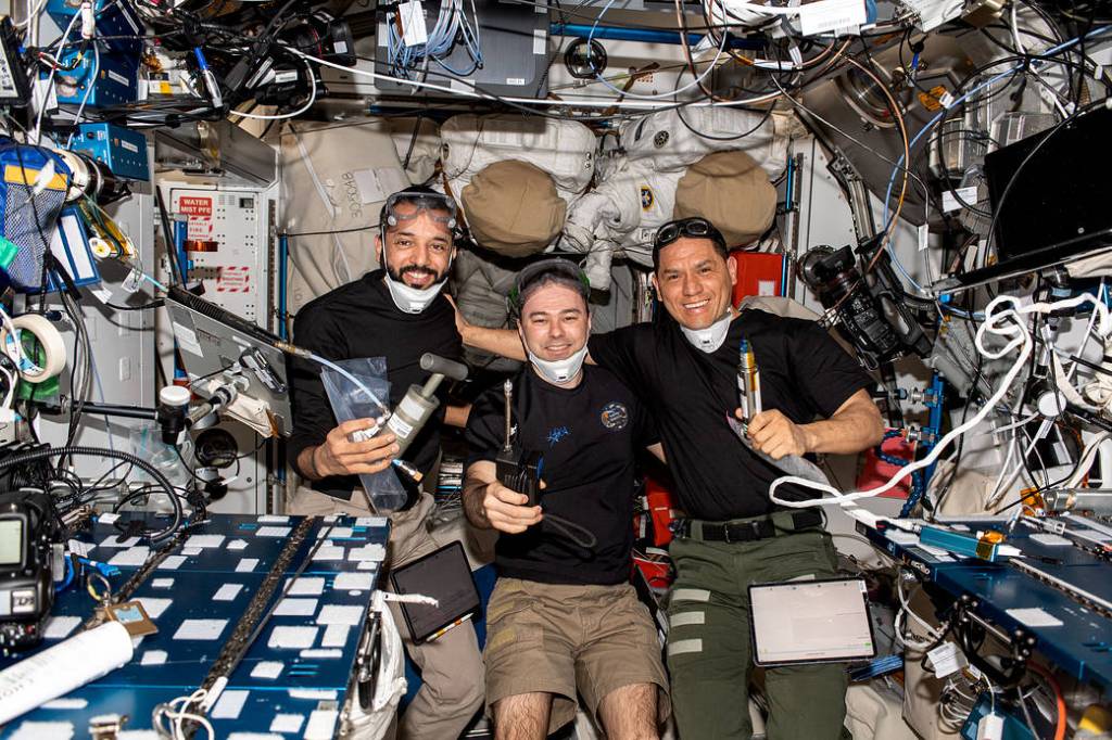 Expedition 69 Flight Engineers pose for a portrait inside the space station
