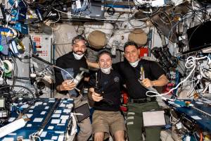 Expedition 69 Flight Engineers pose for a portrait inside the space station