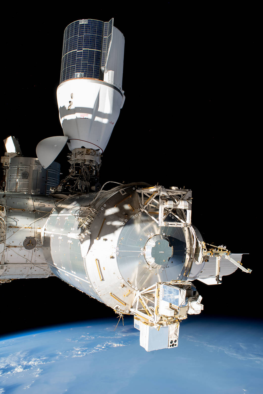 Two SpaceX Dragon vehicles are pictured docked to the space station