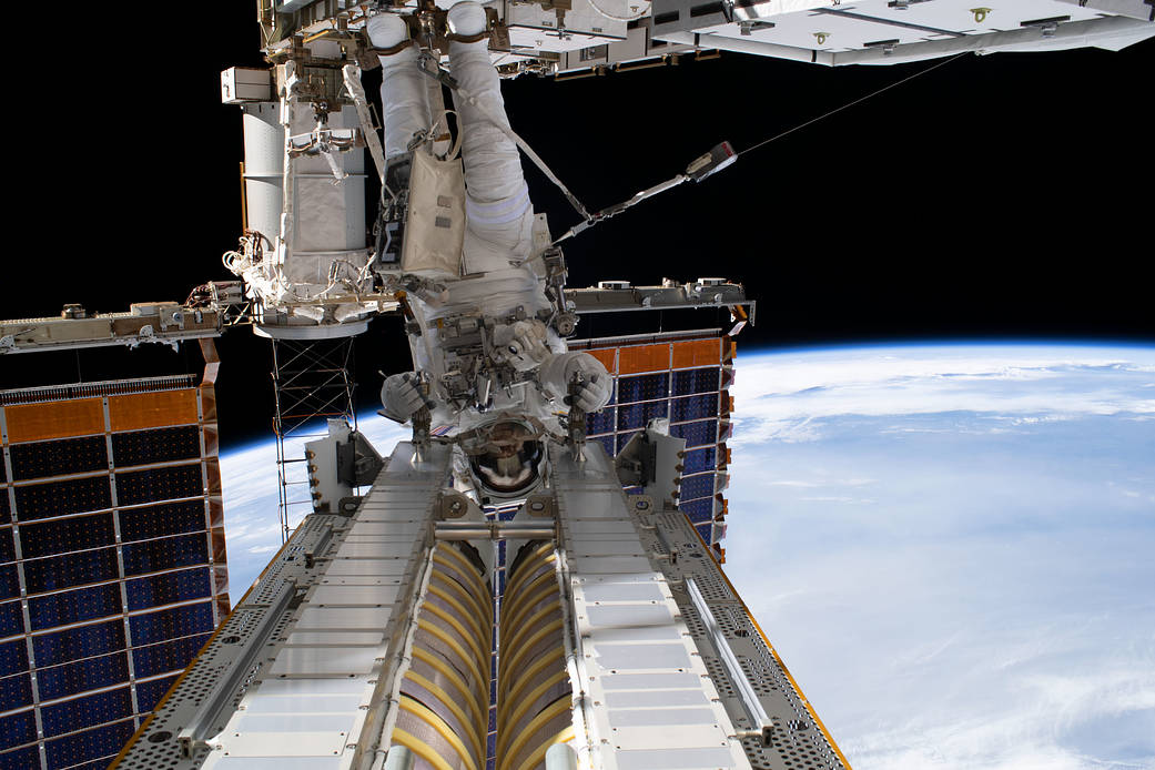NASA spacewalker Stephen Bowen installs a roll-out solar array
