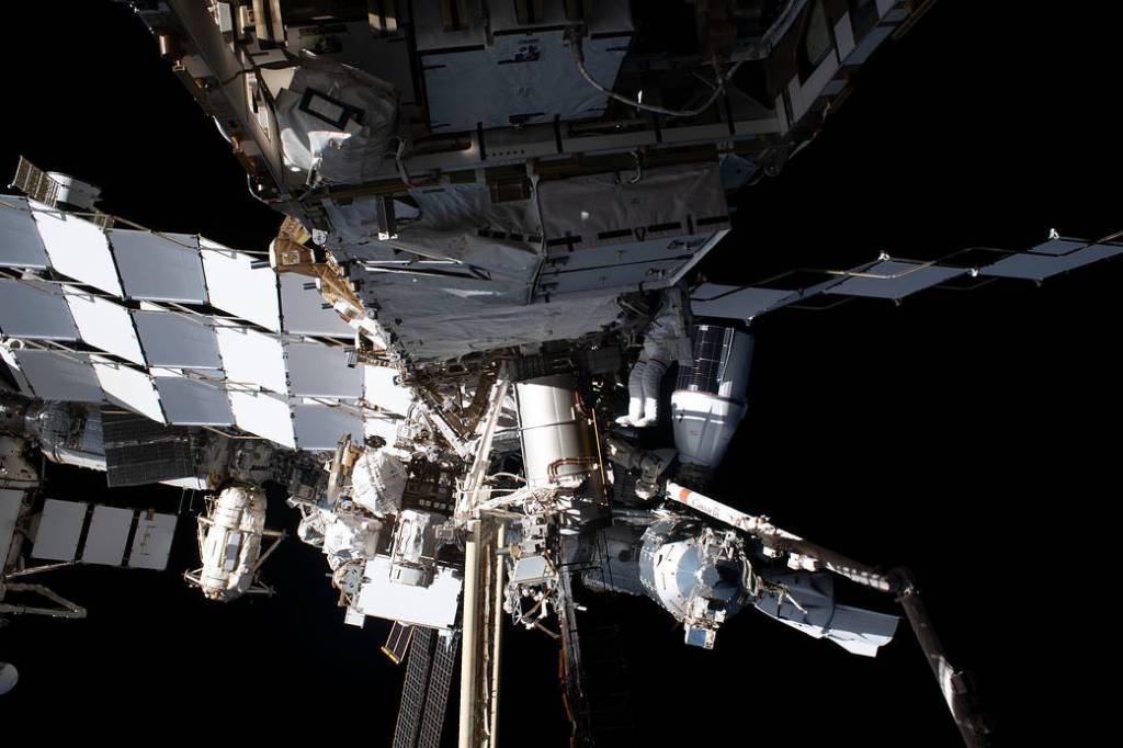 Astronaut Woody Hoburg tethered to the space station