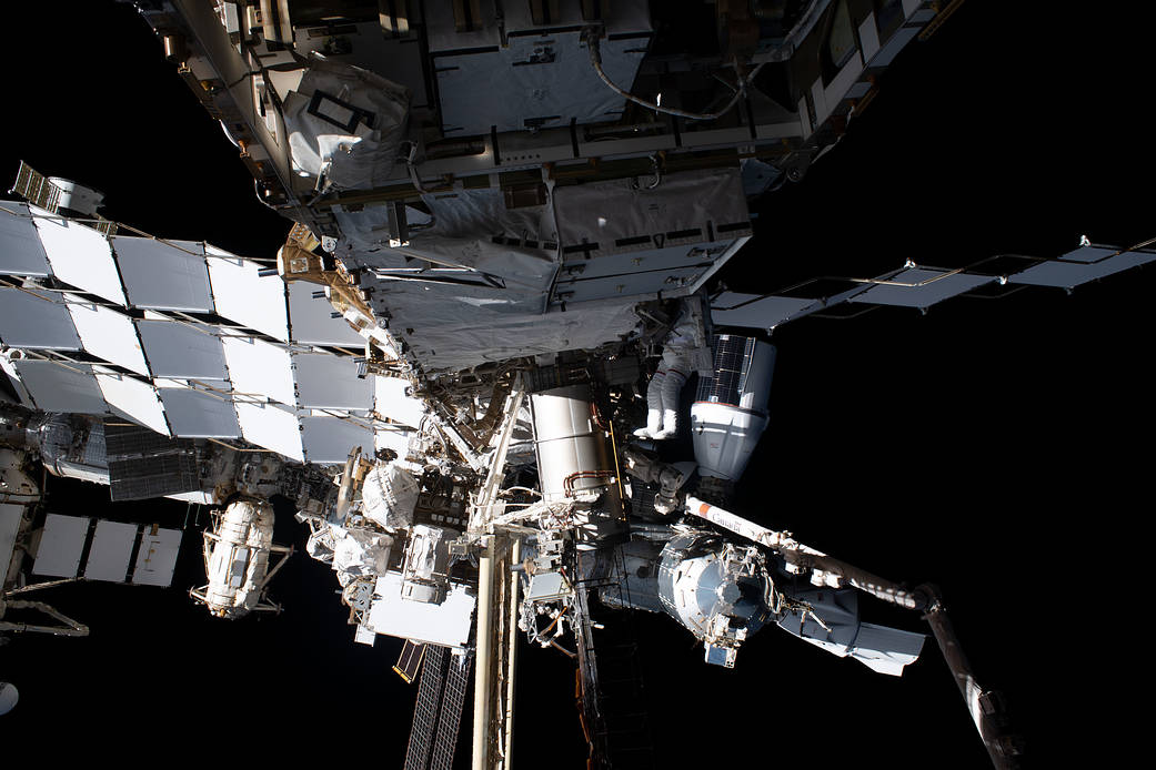 Astronaut Woody Hoburg tethered to the space station