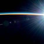 Earth's atmosphere glimmers above the Pacific Ocean