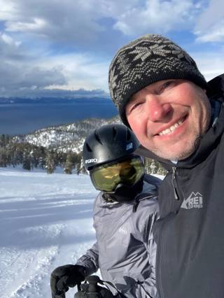Todd Ensign selfie with his son on a snowy mountain