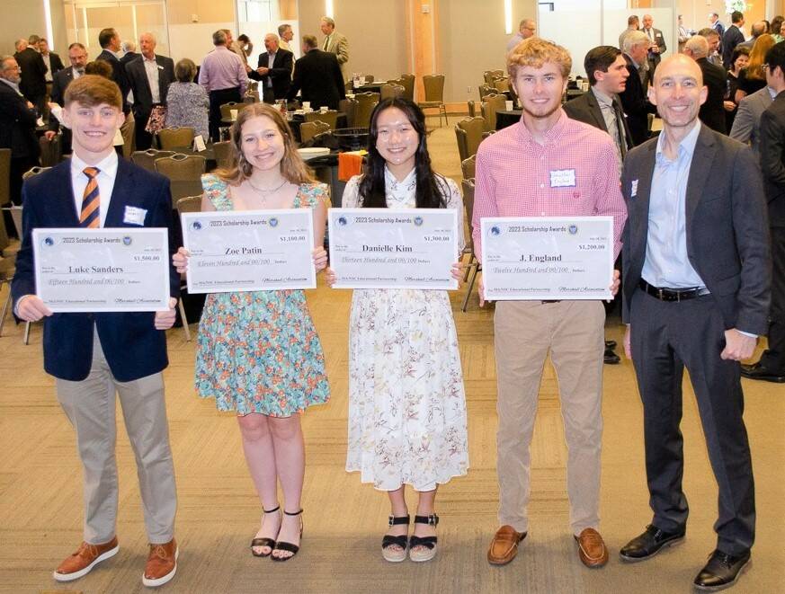 From left, Luke Sanders, Zoe Patin, Danielle Kim, and Jonathon England display their scholarship awards from the Marshall Association along with Gabriel Swiney, senior policy adviser in NASAs Office of Technology, Policy, and Strategy.