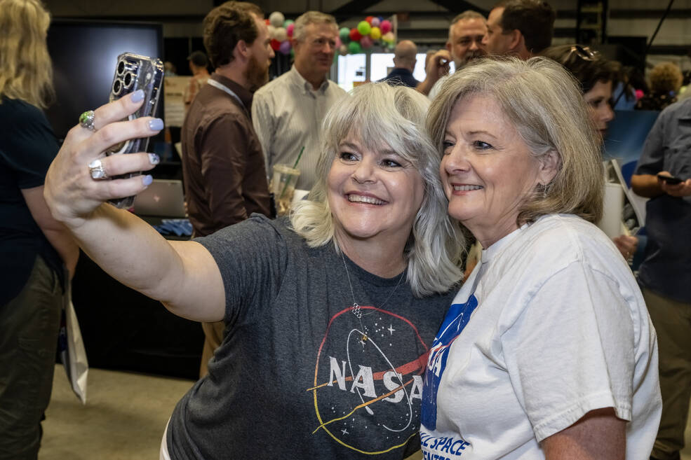 Marshall team member Leigh Martin, left, and Center Director Jody Singer pause for a selfie together at the Marshall Showcase.