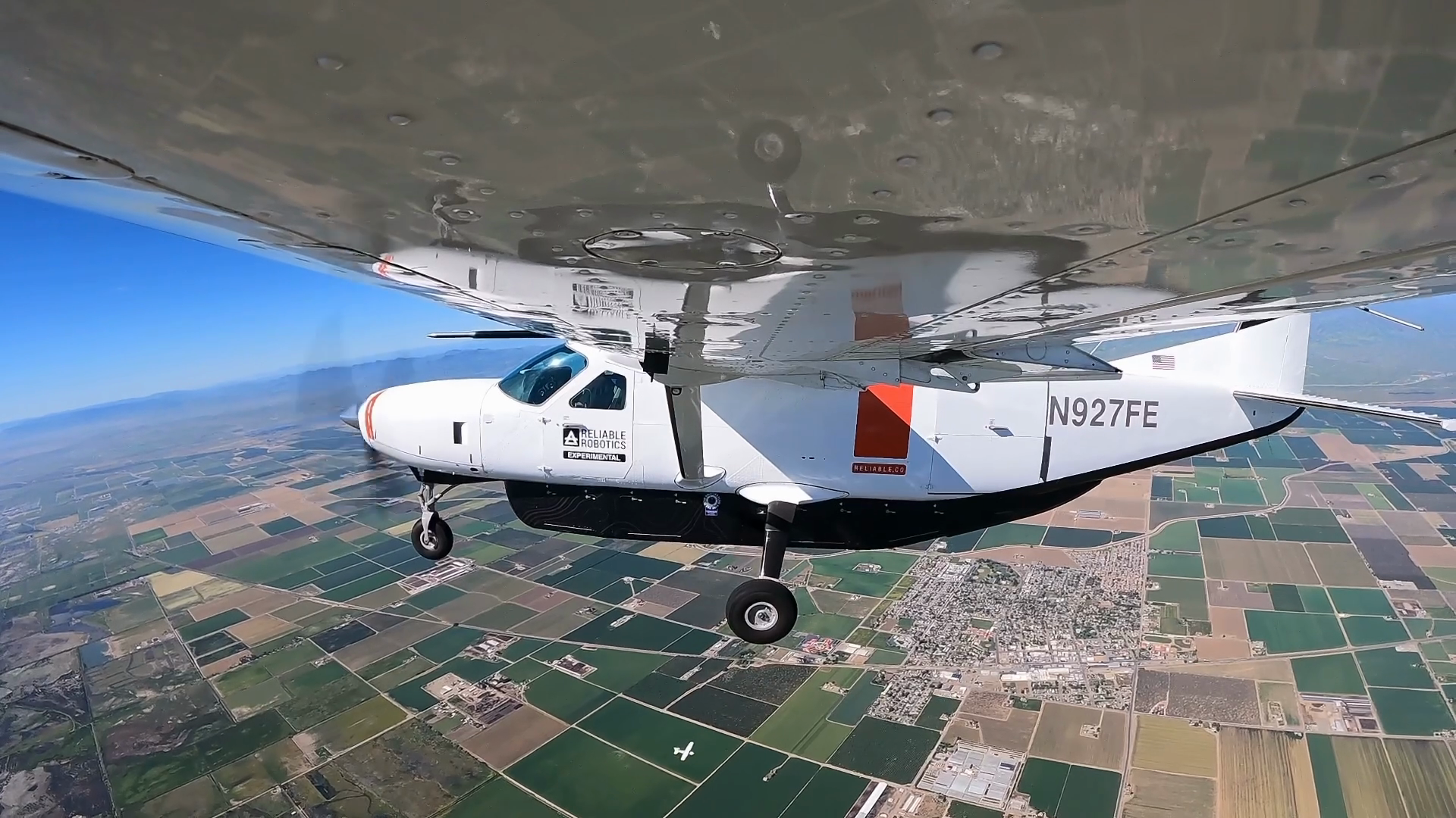 A side view of an aircraft in flight.