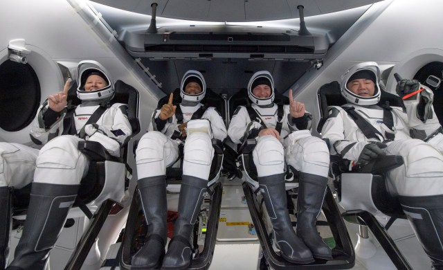 NASA astronauts Shannon Walker, left, Victor Glover, Mike Hopkins, and Japan Aerospace Exploration Agency (JAXA) astronaut Soichi Noguchi, right are seen inside the SpaceX Crew Dragon Resilience spacecraft onboard the SpaceX GO Navigator recovery ship shortly after having landed in the Gulf of Mexico off the coast of Panama City, Florida, Sunday, May 2, 2021.