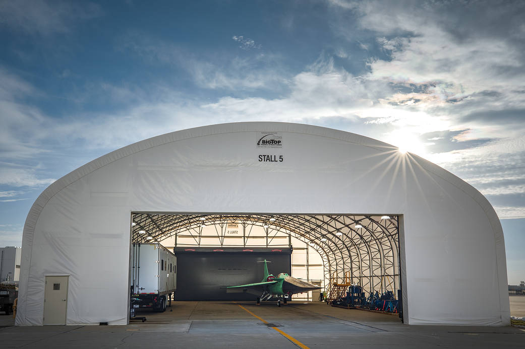 A view looking into the hangar where NASA's X-59 is parked.