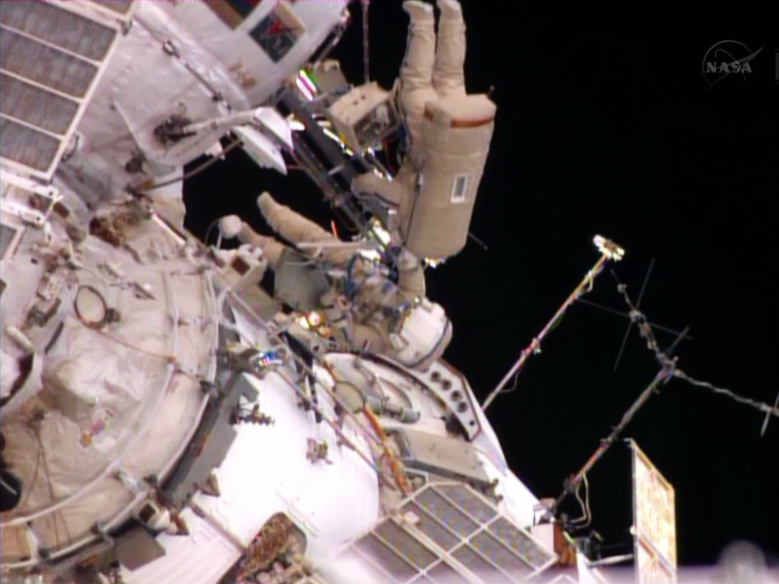 Spacewalkers Oleg Kotov and Sergey Ryazanskiy get ready to enter the Pirs docking compartment.
