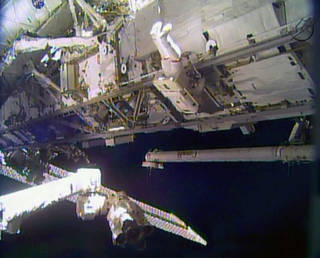 Astronaut Rick Mastracchio works outside the International Space Station during the first of a series of spacewalks to replace a degraded ammonia pump module.