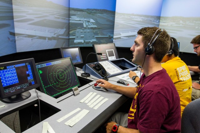 University Leadership Initiative student participants work inside an air traffic management simulator used to train future air traffic controllers at Arizona State University.