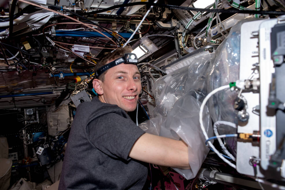 NASA astronaut Woody Hoburg loads tissue cassettes into the Bio-Fabrication Facility for the BFF-Meniscus-2 investigation to print meniscus tissue in space.