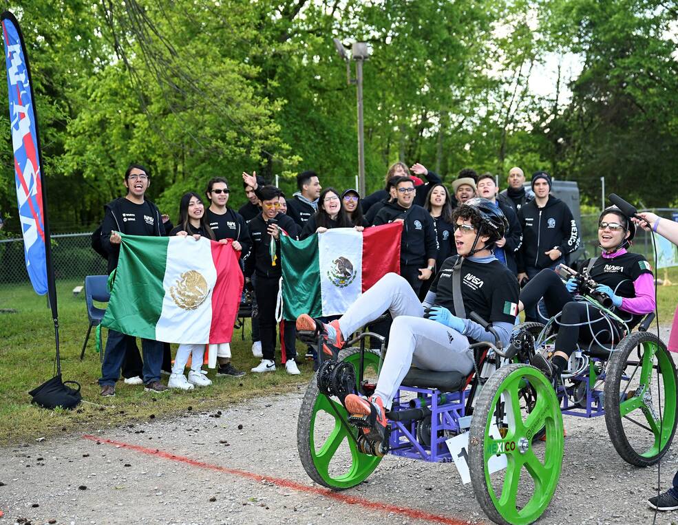 Students from the TecnolÃ³gico de Monterrey, Cuernavaca, Mexico, cheer for their teammates during the 2023 competition.